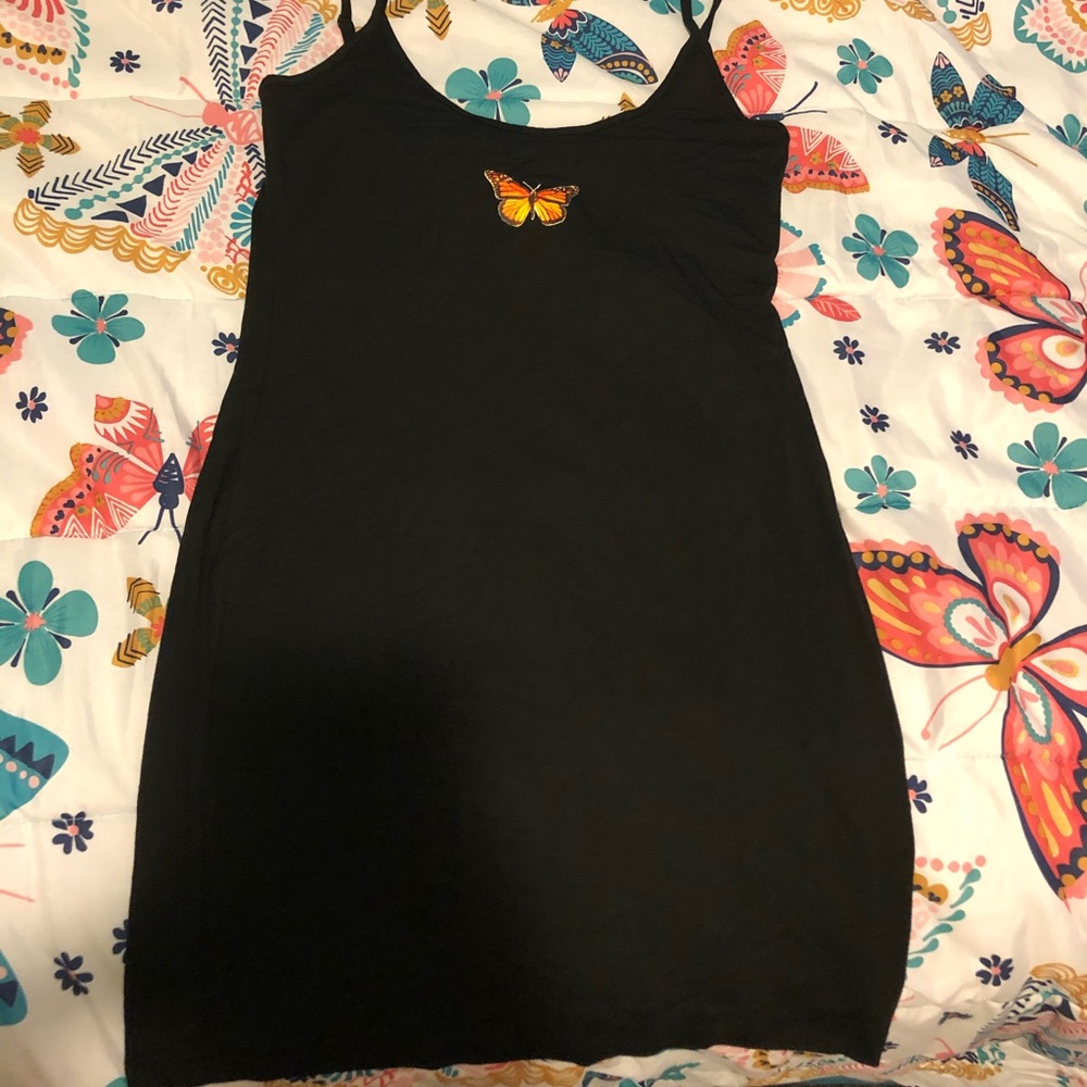 Black Dress With Butterfly in The Middle .